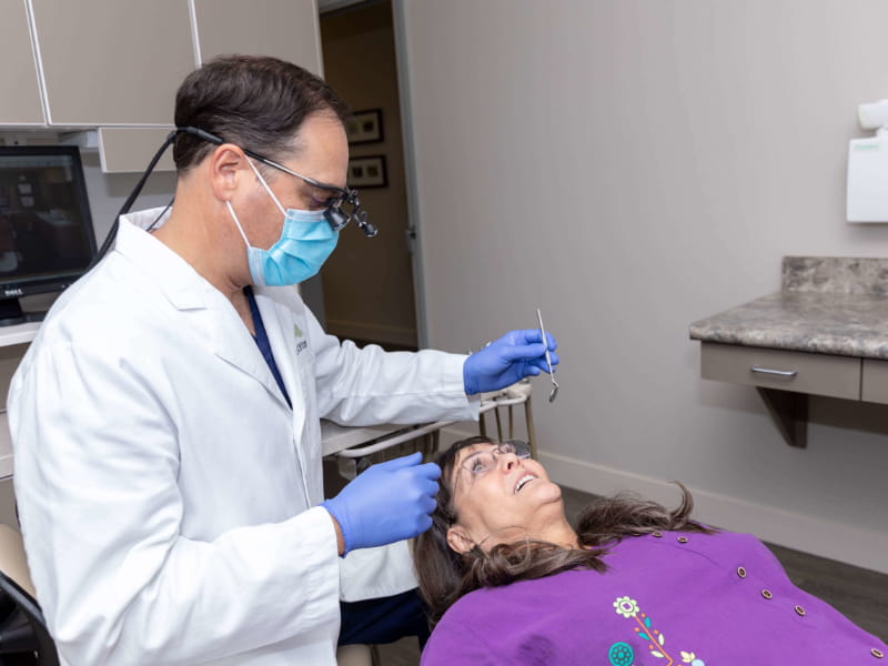 Dr. Filippi explaining to patient which tooth will be extracted.